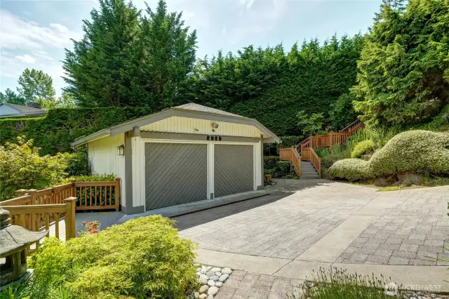 The detached 2 car garage and paver driveway