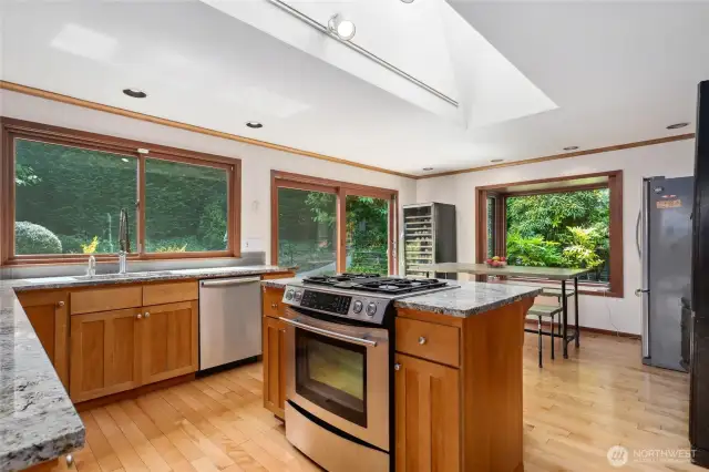 The cherry and granite kitchen features stainless steel appliances.