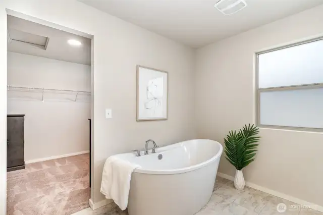 En Suite looking into walk in closet space