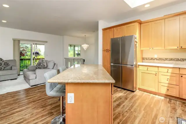 Kitchen features granite countertops.