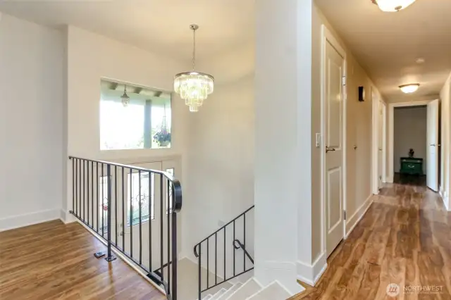 Hallway to Bedrooms. Stairs to entry and lower level.