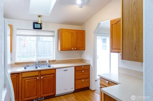 Kitchen overlooks the backyard.