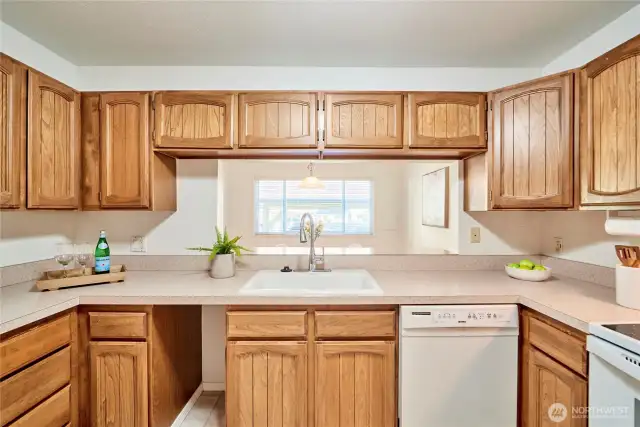 A look over the kitchen sink into the dining room.