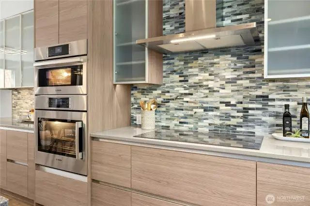 The Zephyr professional hood and a 36-inch Thermador 'Freedom' induction cooktop (flexibility to put your pans anywhere on the cooktop) were also added. A Bosch oven and microwave/convention oven were installed as well.