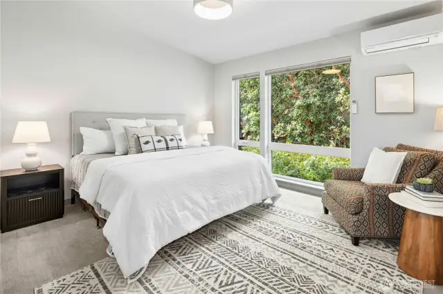 One of two ensuite bedrooms on the upper level. The entire home has an upgraded heat pump system for effliceint cooling and heating.