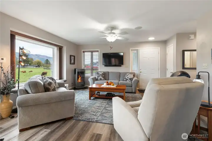 Walk to the dining and turn around to see the cozy fireplace and friendly living room. Sit and read, enjoy the view or just rest...