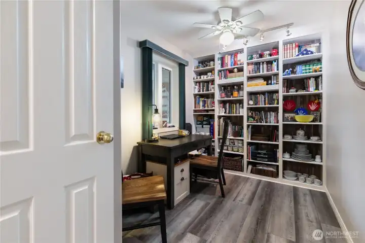 Across the hall from the kitchen is the den. A great place to work, study or relax...