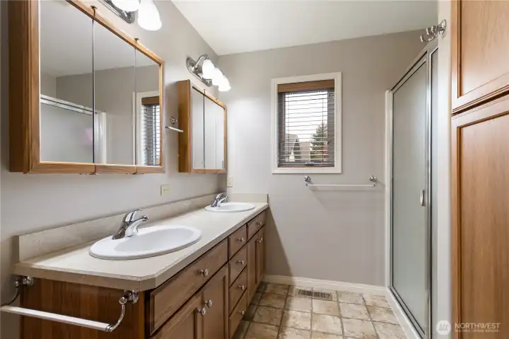 Primary onsuite has a large walk-in shower, dual vanity and plenty of linen storage...