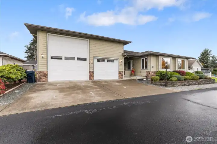 One of the features of this home is the huge RV garage. The big door is 10' wide and 14' tall. With the 43-foot interior depth it easily will fit major size motorhomes. The second door is 8' wide and 10' tall, obviously large enough for a big van, pickup or your sedan. In the rear of the right-side space is 12'6" x 15' heated shop.