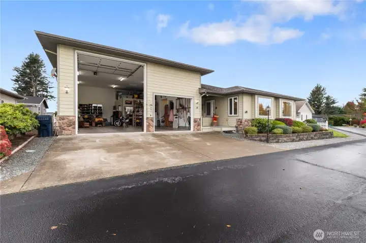 Since the seller no longer has a motorhome, the bay has some items in storage. You can see the heated shop with added storage overhead. All hookups for the motorhome are in the garage, power (which could probably be converted to an EV plug if needed), sewer dump, and water hookup.