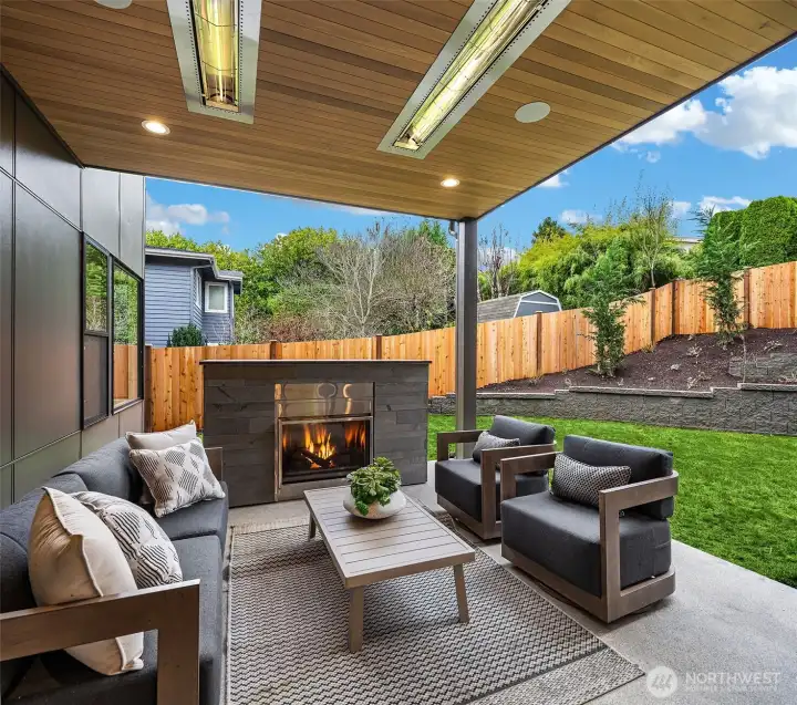 Outdoor covered living area with fireplace