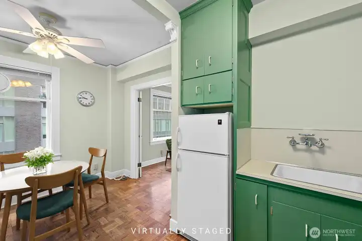 Kitchen with dining area.  Virtually staged.