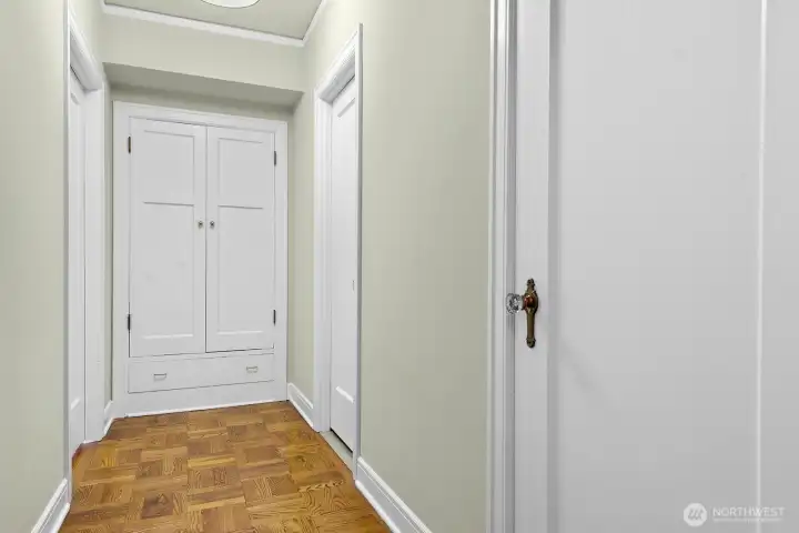 Hallway to full bath, and spacious bedroom.   The closet at the end of the hall offers loads of additional storage space.