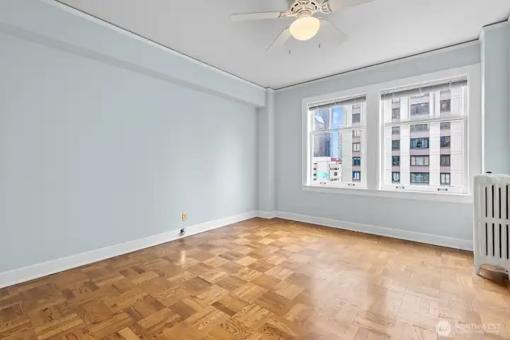 Spacious bedroom with downtown views!  Double closet storage, parquet floors, and radiant heat.