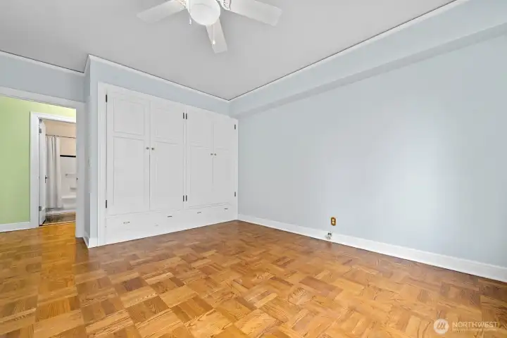 Double closet storage in spacious bedroom.