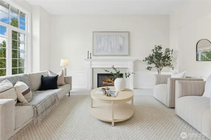 From this Living Room, enjoy views towards Mt Rainier to the southeast, 10' ceilings and a gas fireplace.