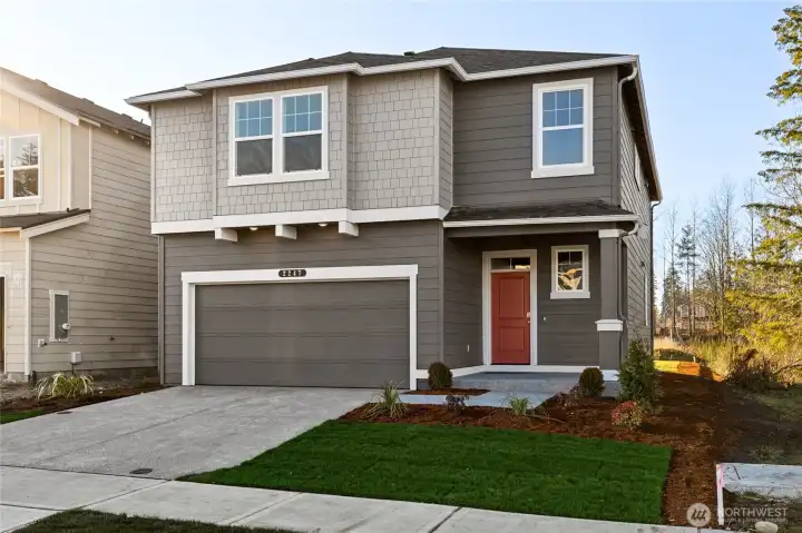 Charming two-story Craftsman-style home. Photo of same plan but not actual home and reflects different colors and elevation.