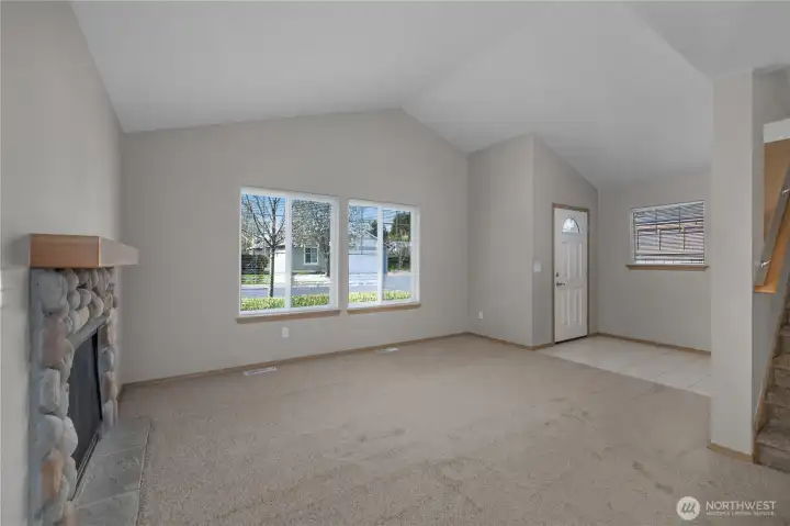 Vaulted ceiling and cozy gas fireplace makes the living room very inviting.