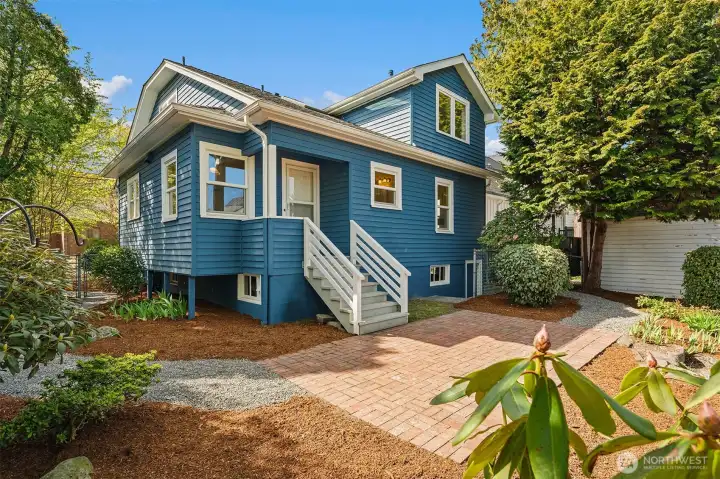 Covered back porch leads to spacious patio