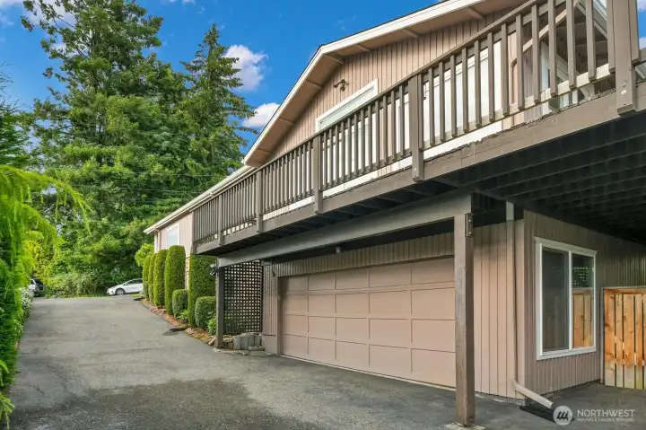 Larger than the front view. Driveway and 2 car Garage Larger than the front view. Driveway and 2 car Garage