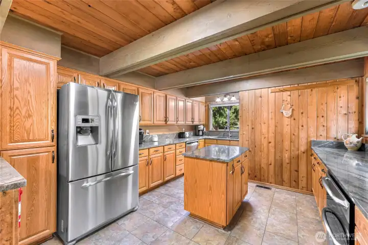 Open kitchen layout with newer appliances