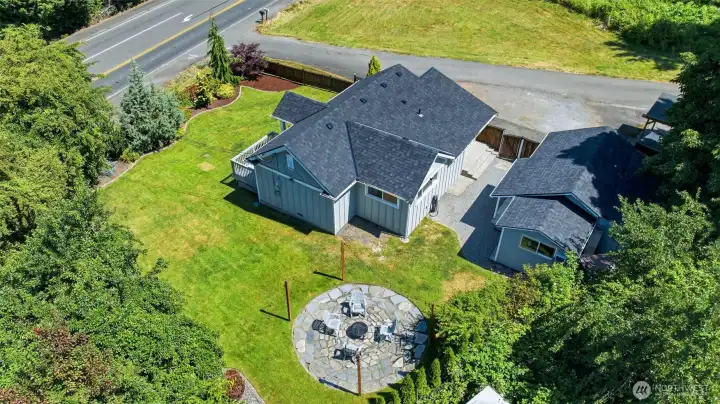From above, you can truly appreciate the incredible layout, matching detached garage, and generous yard space. From above, you can truly appreciate the incredible layout, matching detached garage, and generous yard space.