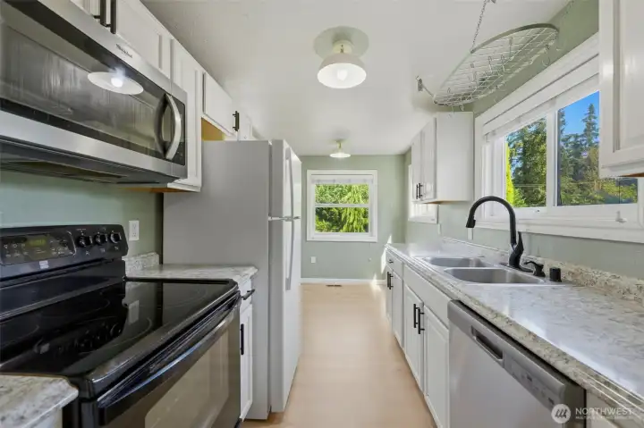 Bright, functional, and fully equipped! Every appliance stays, making this charming kitchen completely move-in ready. Bright, functional, and fully equipped! Every appliance stays, making this charming kitchen completely move-in ready.