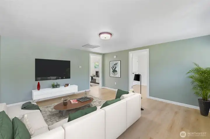 In this virtually staged photo, you can see the fresh coat of paint and the LVP flooring. In this virtually staged photo, you can see the fresh coat of paint and the LVP flooring.