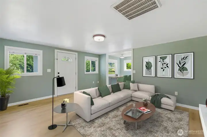 In this virtually staged photo, the living room is coxy but bright from natual lighting. In this virtually staged photo, the living room is coxy but bright from natual lighting.