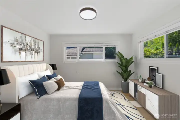 In this virtually staged photo, this spacious bedroom shows a beautiful view of the PNW woods from your backyard. In this virtually staged photo, this spacious bedroom shows a beautiful view of the PNW woods from your backyard.