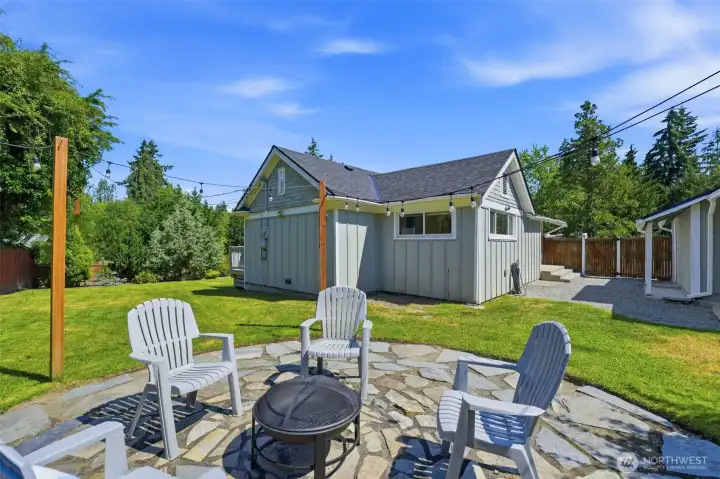 The perfect spot for summer BBQs and crisp evenings around the cozy firepit gathering area. The perfect spot for summer BBQs and crisp evenings around the cozy firepit gathering area.