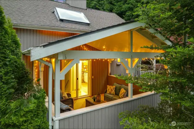 Look forward to cozy summer nights on the covered deck, just off the kitchen.