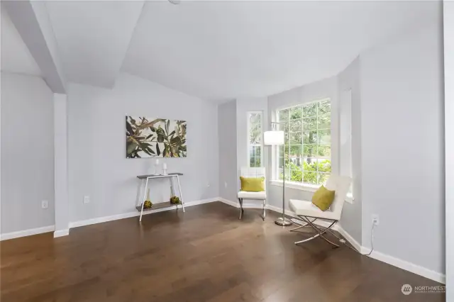 A bay window brightens the spacious living room.