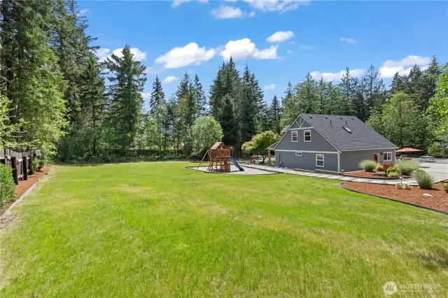 Enjoy the freedom of a fully-fenced, oversized grassy yard that’s perfect for kids, pets, and outdoor activities. The lush green lawn and established plants are maintained with a fully automated sprinkler and irrigation system, making upkeep effortless. Beautiful bark beds, elegant hardscaping, and mature landscaping create a serene outdoor retreat with plenty of space for play, gardening, or future outdoor projects.