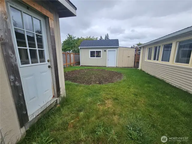 Enclosed Backyard with Outbuildings