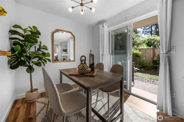Very comfortable dining area with your glass slider out to the patio and garden area.