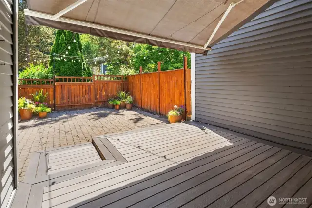 With a large retractable awning, vibrant flower pots, and glowing Italian string lights, it’s an ideal entertainment space by day and a serene haven by night.