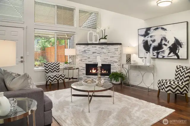 Inside, you're welcomed by soaring ceilings and an abundance of natural light that pours into the cozy yet spacious family room.
