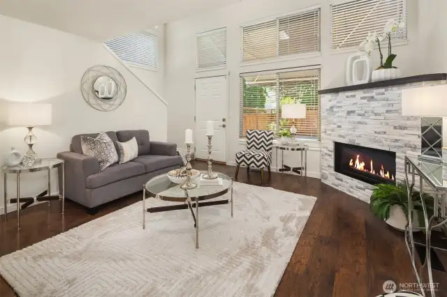 The family room is anchored by a stunning modern stone fireplace, perfect for those crisp PNW evenings.