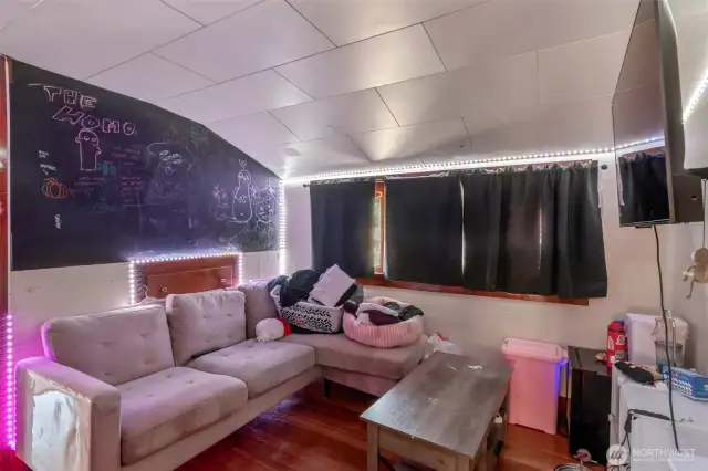 upstairs living room space with 2 bedroms