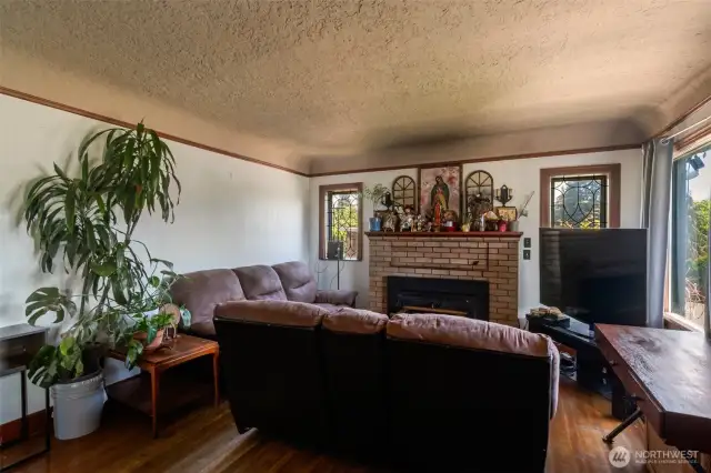 original hardwood floors and wood fireplace with insert. Check out the coved ceilings