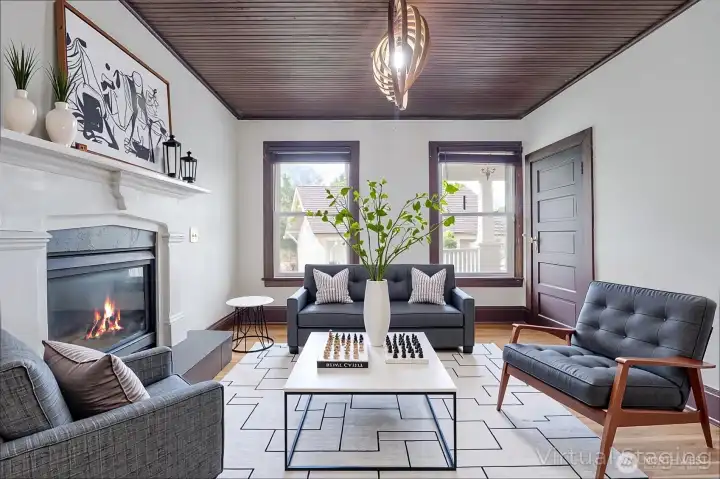 Virtual staged sitting room with fireplace