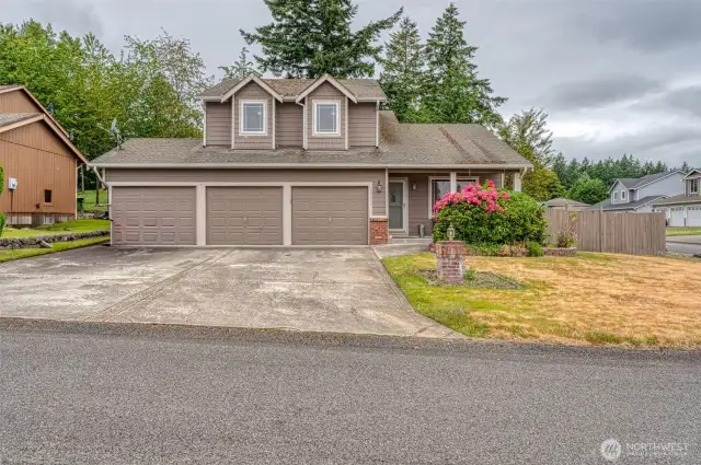 Spacious Corner Lot Retreat with Lush Landscaping & Vaulted Ceilings  Welcome to this beautifully maintained home on a private, fully fenced corner homesite surrounded by mature, lush landscaping. Step inside to soaring vaulted ceilings in the formal living and dining rooms, filled with natural light and accented by durable laminate flooring. The open-concept kitchen features abundant cabinetry, a large granite island perfect for entertaining, pantry, and flows seamlessly into the tile-floored great room with a cozy gas fireplace. Step out to the covered deck—ideal for year-round outdoor living. The expansive Owner’s Suite boasts vaulted ceilings, a luxurious 5-piece bath, and a relaxing jacuzzi tub. With two additional guest bedrooms, generous storage throughout, and a prime location near military bases, shopping, equestrian facilities, and freeway access—this home truly has it all!