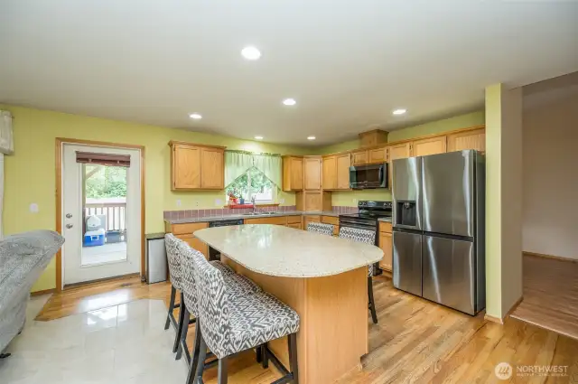 Enjoy the ease of entering your backyard through the kitchen and great room