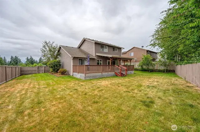 Enjoy this private fenced back yard on a corner homesite.