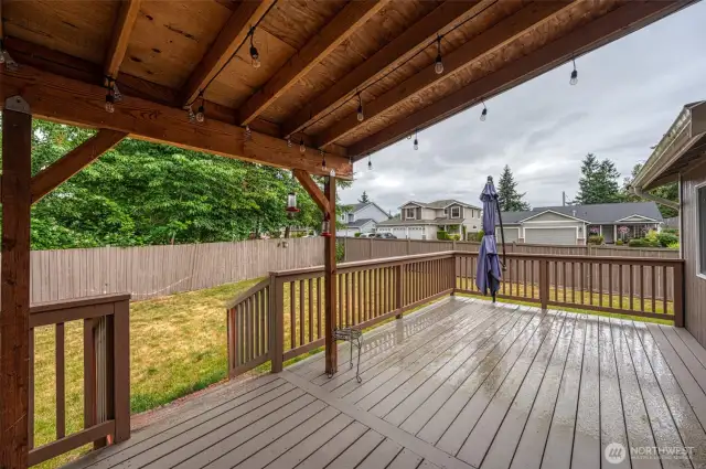 Oversized deck off the back partially covered.
