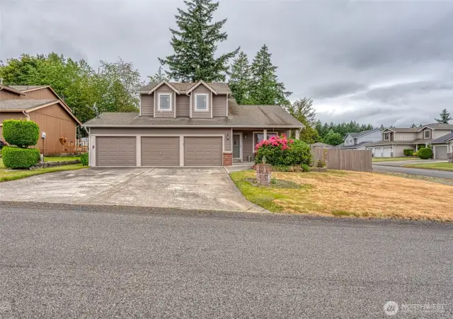 3 car garage and large driveway.