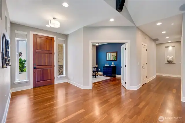 Entry, double-doored office/dining room and hallway toward the primary suite.
