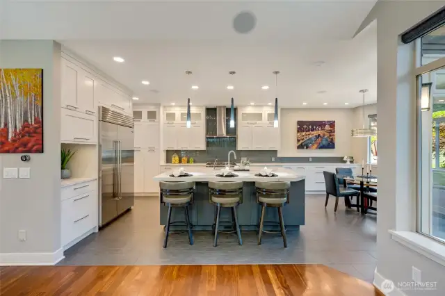 The kitchen is well equipped with professional grade appliances, a 48" Sub-Zero refrigerator, Asko dishwasher, Kobe hood fan and a Miele 6 burner dual fuel stove and an oven with steam function.  The cubby to the left of the refrigerator is designed as a coffee station! And the cabinet above the coffee nook can accomodate a microwave.