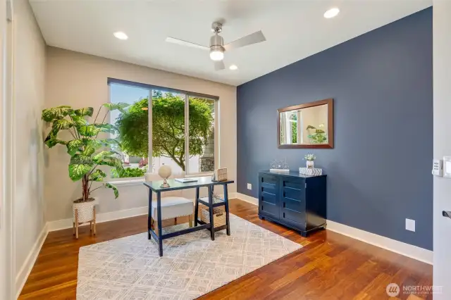 Although this room is staged as an office, it can also function as a formal dining room.
